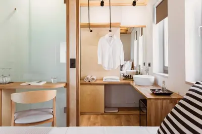 a bathroom with a sink and a mirror at Thallos The Boutique in Chania Town