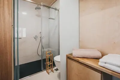 a bathroom with a shower and a toilet at Thallos The Boutique in Chania Town