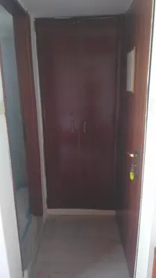 a room with a closet with a glass door at Spamandos Rooms in Palaiochóra