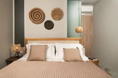 a bedroom with a bed with two pillows on it at Villas Plumeria in Palaiochóra