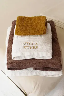 a pile of towels sitting on a table at Vryses Crete-Village Vibes in Vryses