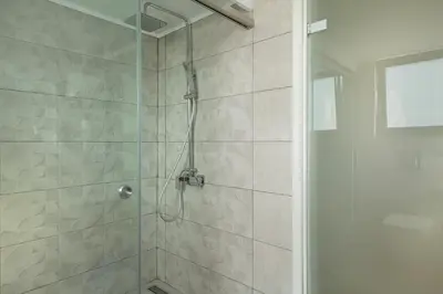a bathroom with a shower with a glass door at Villa Enny, 3 BD with Private Heated Pool in Ayiá