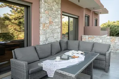 a living room with a couch and a table at Villa Enny, 3 BD with Private Heated Pool in Ayiá