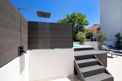 a water feature on the side of a house at Kappa Residence in Chania Town