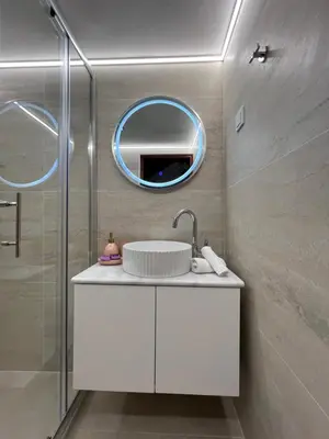 a bathroom with a sink and a mirror at SeaView villa with piano by Chania Living Stories in Chania Town