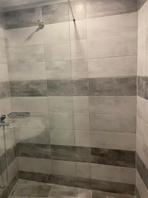 a shower with a glass door in a bathroom at Casa Argo in Chania Town