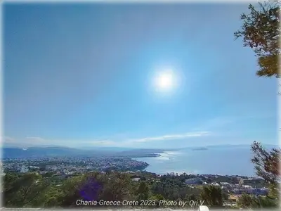 a view of the ocean with the sun in the sky at Belle Verte City Chania in Chania Town