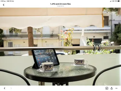 a table with a laptop and two cups on it at Chania Center Apartment in Chania Town