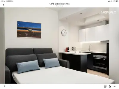 a living room with a bed and a kitchen at Chania Center Apartment in Chania Town