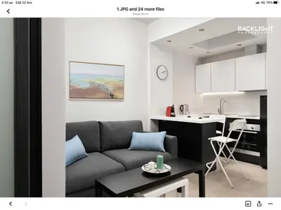 a living room with a couch and a kitchen at Chania Center Apartment in Chania Town