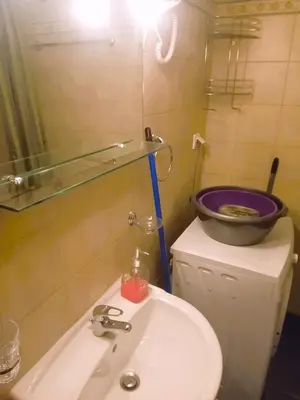 a bathroom with a sink and a bowl on a counter at Alkioni City Apartments in Chania Town
