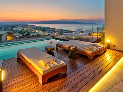 a room with two beds on a balcony with a view at Alectrona Living Crete, Apartment RocSea in Plataniás