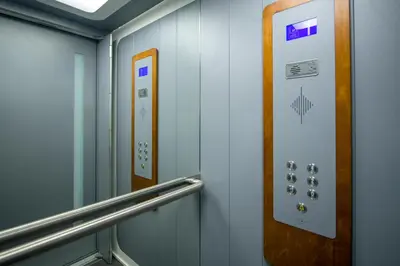 a elevator with a door and a metal railing at Deluxe City Hotel in Chania Town