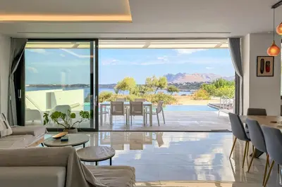 a living room with a view of the ocean at Villa Valentina Chania in Kalathas