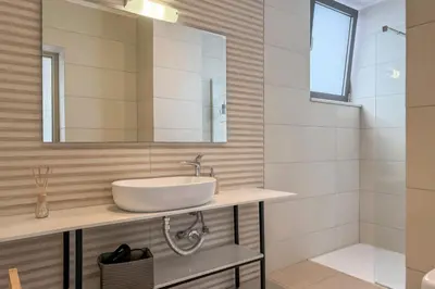a bathroom with a sink and a mirror at Villa Valentina Chania in Kalathas