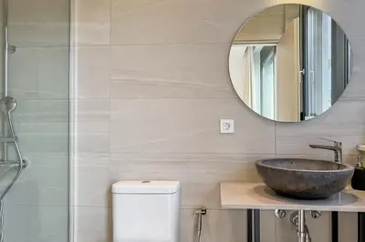 a bathroom with a sink and a mirror at Villa Valentina Chania in Kalathas