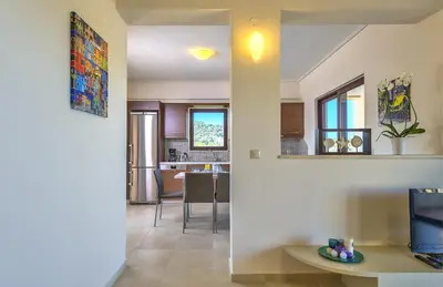 a living room and a kitchen with a dining room at Margarita's Villas in Chania Town