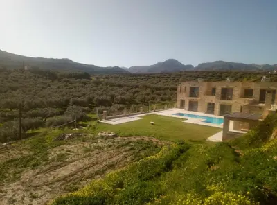 an aerial view of a house with a swimming pool at Vilitsa Stylianos in Kounoupítsa