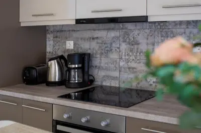 a kitchen with a coffee maker on a counter at Casa Gardenia-modern apartment next to the beach, near Old Town in Chania Town