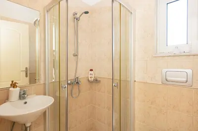 a bathroom with a shower and a sink at Lake and Sea Villa in Tersanas