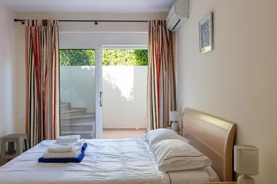 a bedroom with a bed with towels on it at Lake and Sea Villa in Tersanas