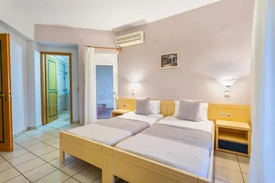 a bedroom with two beds in a room at Anna Αpartments II in Agia Marina Nea Kydonias