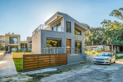 a house with a car parked in front of it at Park View and near the Sea Villa with Private Pool 1 in Chania Town