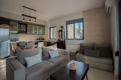a living room with a couch and a table at Villa Marianne in Chania Town