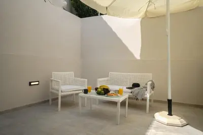 a room with two chairs and a table with a child on it at Mezoneta 