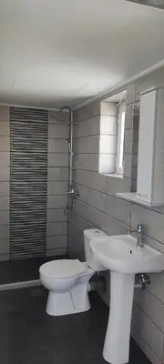a bathroom with a toilet and a sink at Chania City Apartments in Chania Town