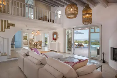 a living room with a couch and a table at Villa Everlong in Vamos