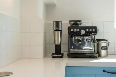 a coffee maker sitting on a counter in a kitchen at Villa Everlong in Vamos