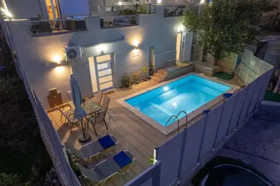 an overhead view of a swimming pool at night at Vista Magica in Chania Town