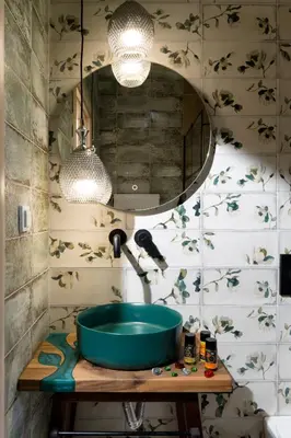 a bathroom with a green sink and a mirror at Majestic Villa in Chania Town