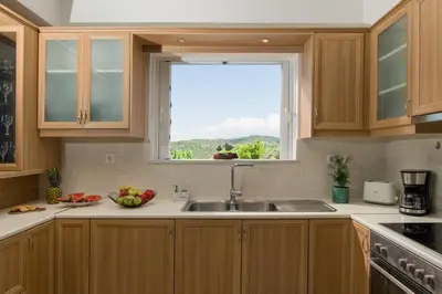 a kitchen with a sink and a window at Majestic Villa in Chania Town