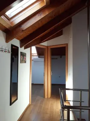 a room with a table and a chair and a ceiling at Roof-Garden Apartment in Chania Town