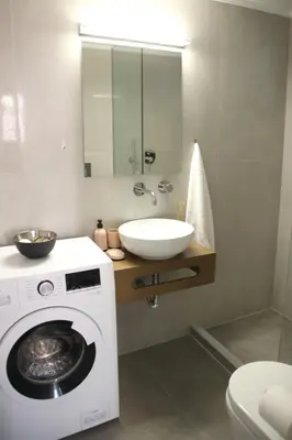 a bathroom with a washing machine and a sink at New Cozy Chic Apt-Ryfete Luxury Living in Kalathas