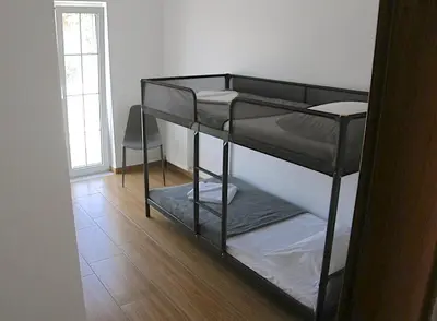 a room with two bunk beds in a room at Modern villa with infinity pool close to the sea in Tavronitis