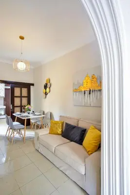 a living room with a couch and a table at CASA MARIGO (OLD HARBOUR) in Chania Town