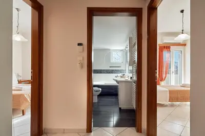 a bathroom with a toilet and a sink in a room at Sea View House in Kissamos