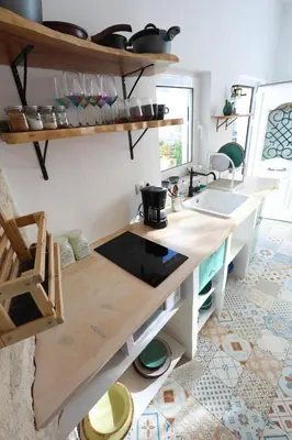 a kitchen with a counter top and a sink at Ravi Boutique Home - 1 minute walk from beach in Kalyves