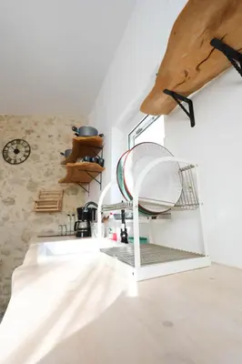 a kitchen with a sink with a drying rack at Ravi Boutique Home - 1 minute walk from beach in Kalyves