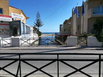 a view of the beach from a street at Lemon Tree House in Kalyves