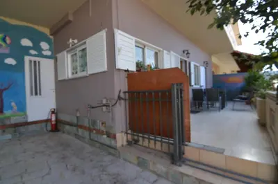 a house with a gate on the side of it at Paradise House with Private Pool in Kissamos