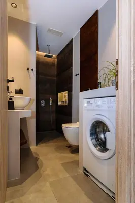 a bathroom with a washing machine and a sink at Effrosini Panorama View in Nopíyia