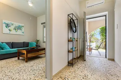 a living room with a couch and a table at Golden Key apartments in Chania Town