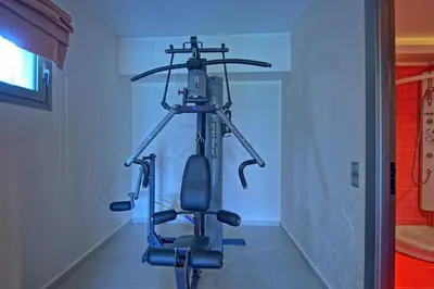 a room with a exercise bike in a room at Cabanavillas Rio by PosarelliVillas in Agia Marina Nea Kydonias