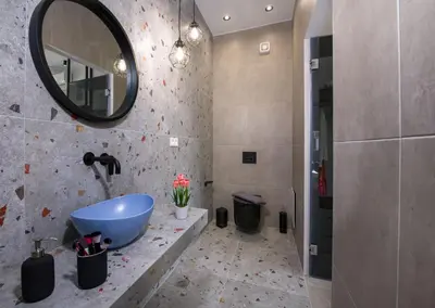 a bathroom with a sink and a mirror at Luxury Villa Eva-Mari with jacuzzi, 50m from the beach in Stalos