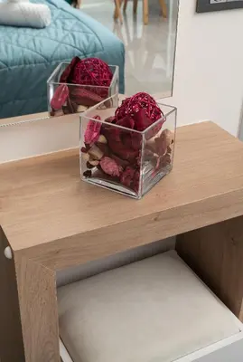 two containers of roses on a wooden table at Archin Boutique suites in Chania Town