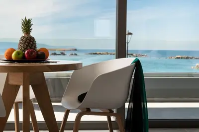 a table with a pineapple and fruit on it at Archin Boutique suites in Chania Town